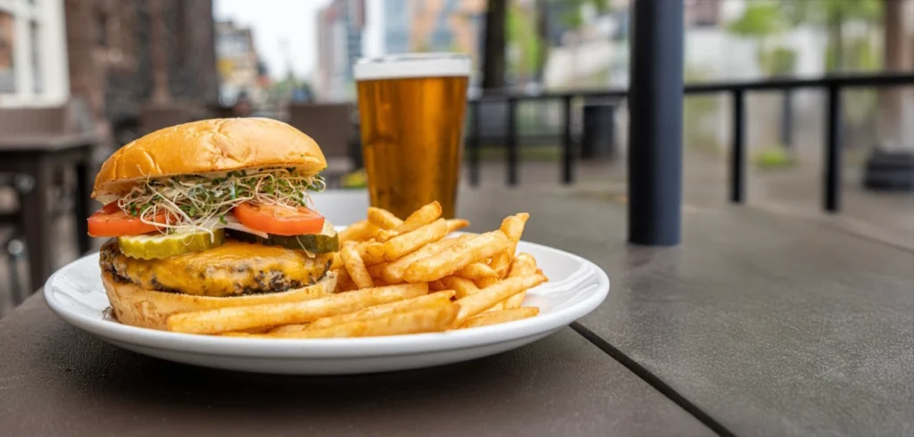 Burger fries and beer on a patio table at fitger's brewhouse